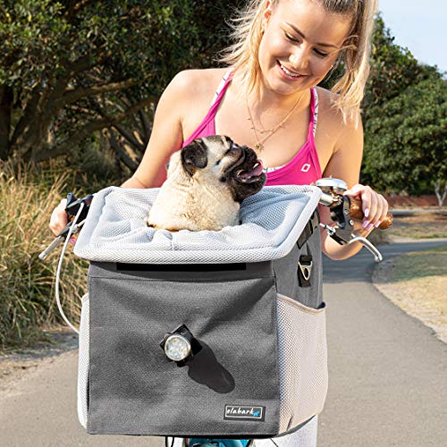 woman on bike with pug in Elabark 4-in-1 dog carrier