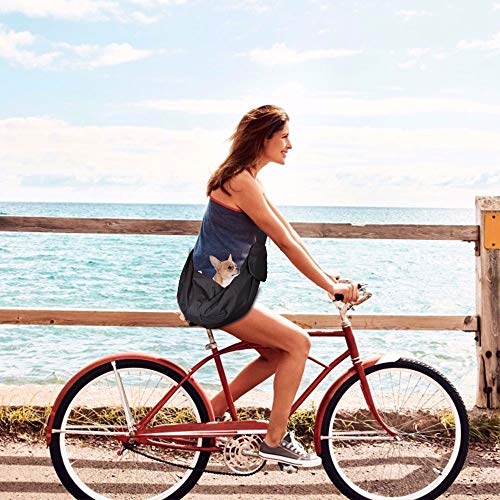 Woman riding bike carrying dog in black Lukovee pet sling