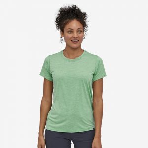 woman in green Patagonia Capilene dog mom clothing