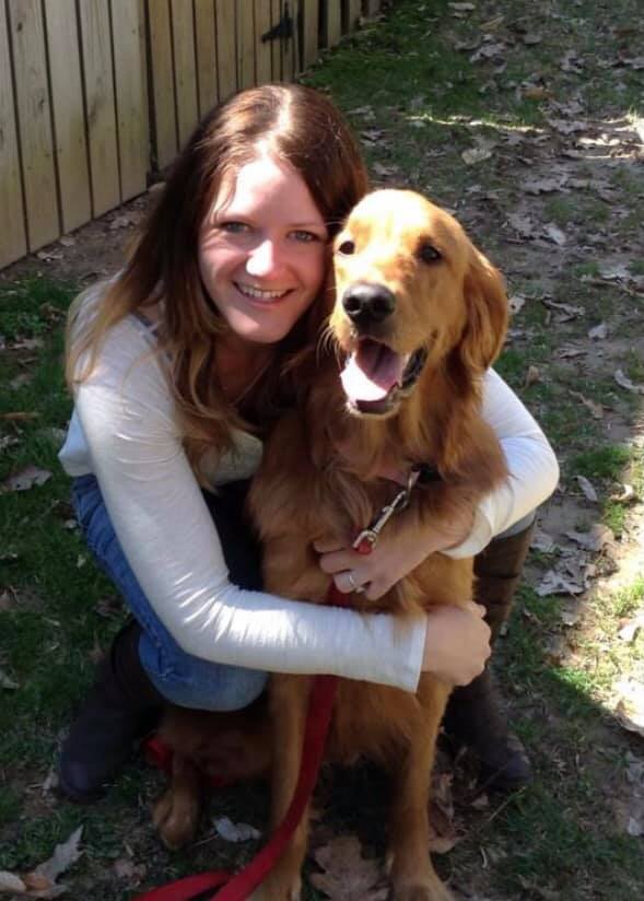 Woman hugging Golden Retriever