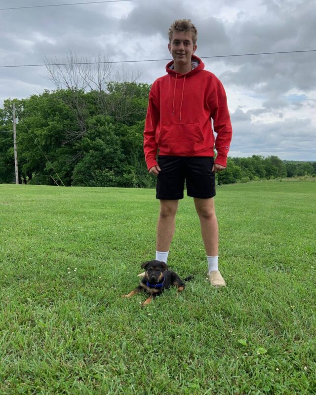 Teen and German Shepherd puppy