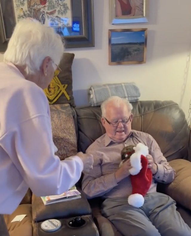 Grandpa holding puppy
